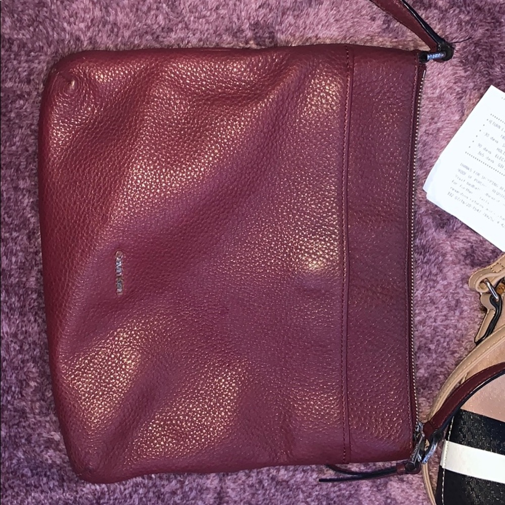 plum purple Calvin Klein side purse. no damage
